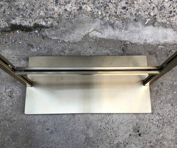 Ảnh chụp bảng standee khung inox vàng tại kho